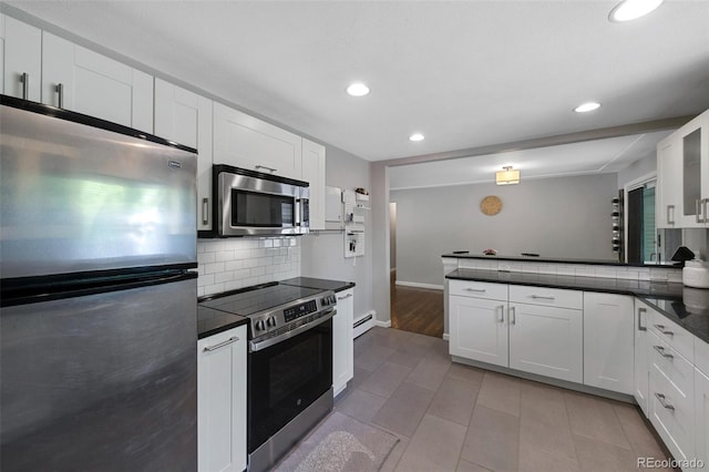 6283 S Prescott St, Littleton, CO 80120 - kitchen featuring appliances with stainless steel finishes, dark countertops, backsplash, recessed lighting, and a peninsula
