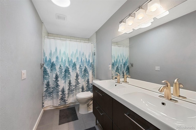 6283 S Prescott St, Littleton, CO 80120 - bathroom featuring double vanity, toilet, tile patterned flooring, and baseboards