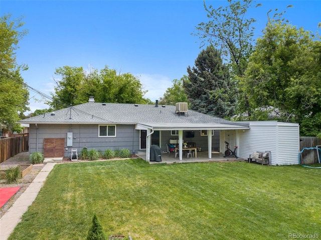 6283 S Prescott St, Littleton, CO 80120 - rear view of house featuring a patio area, a shingled roof, and a chimney