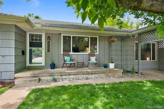 6283 S Prescott St, Littleton, CO 80120 - view of exterior entry with covered porch and roof with shingles