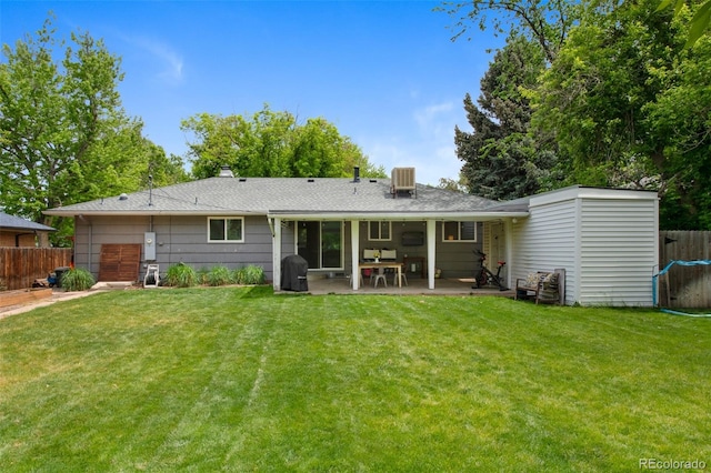 6283 S Prescott St, Littleton, CO 80120 - back of house with a patio, central air condition unit, and a chimney