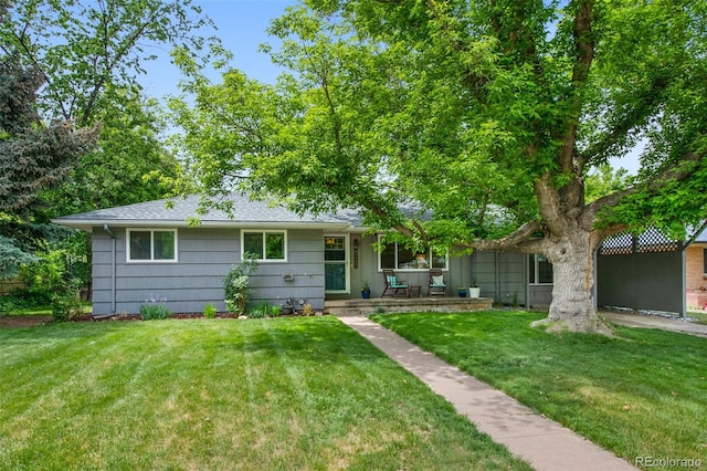 6283 S Prescott St, Littleton, CO 80120 - view of front of home featuring a front lawn, covered porch, and roof with shingles