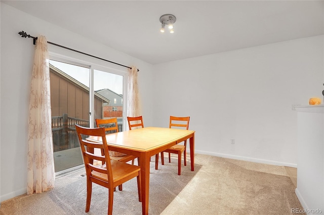 dining area with light carpet