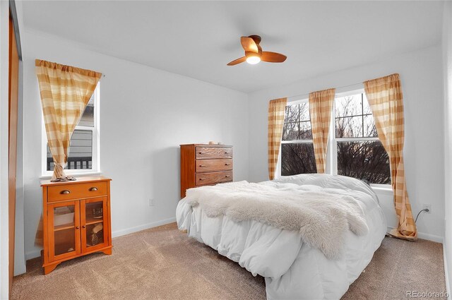 23317 E Saratoga Cir, Aurora, CO 80016 - bedroom with light colored carpet and ceiling fan