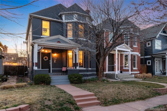 view of front of property with brick siding and a front yard