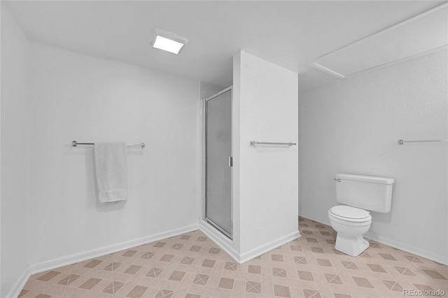 bathroom featuring toilet and walk in shower