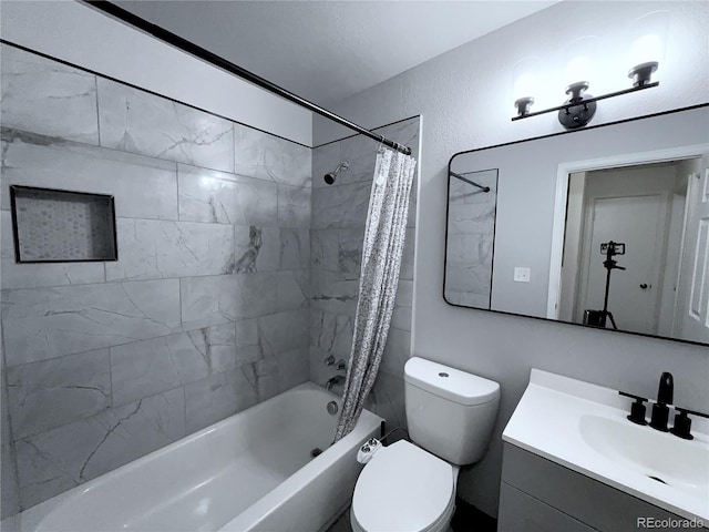 full bathroom with toilet, vanity, and shower / bath combination with curtain