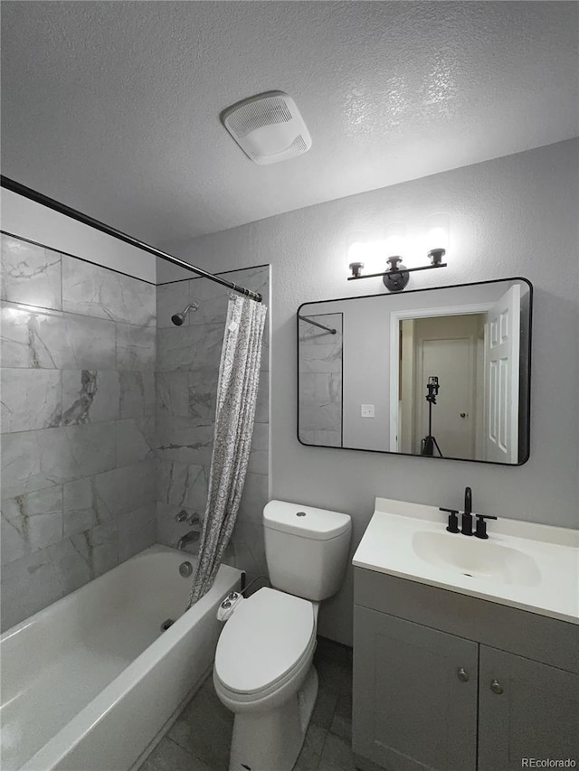 full bathroom featuring a textured ceiling, toilet, vanity, and shower / tub combo with curtain