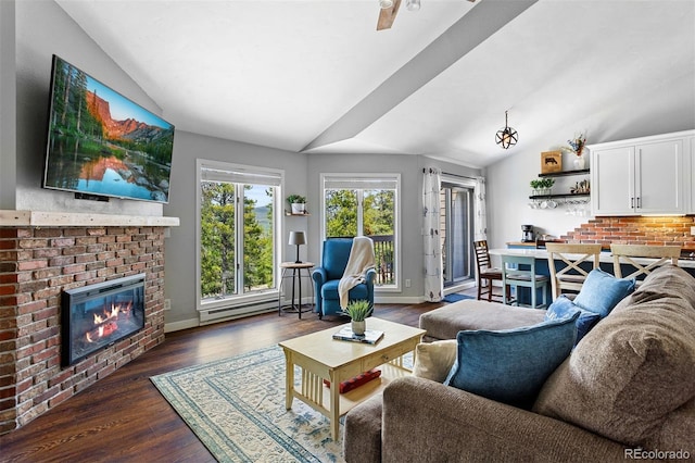 100 County Road 8344 Unit 3, Fraser, CO 80442 - living area featuring lofted ceiling, dark wood-type flooring, and a fireplace