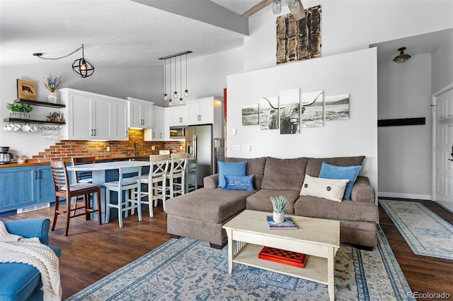 100 County Road 8344 Unit 3, Fraser, CO 80442 - living area with dark wood-type flooring and high vaulted ceiling