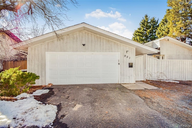 garage featuring wooden walls