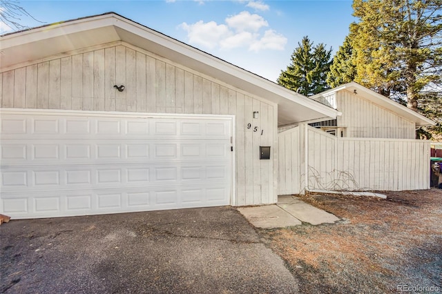 garage featuring wood walls