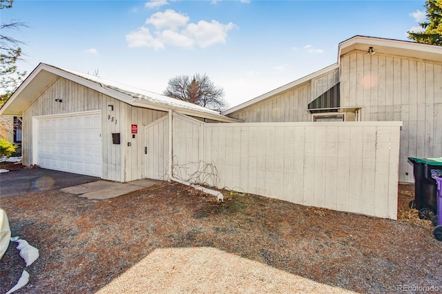 view of side of property with a garage