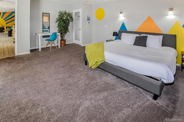 bedroom featuring dark colored carpet