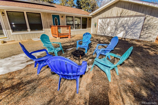 view of patio / terrace with a fire pit