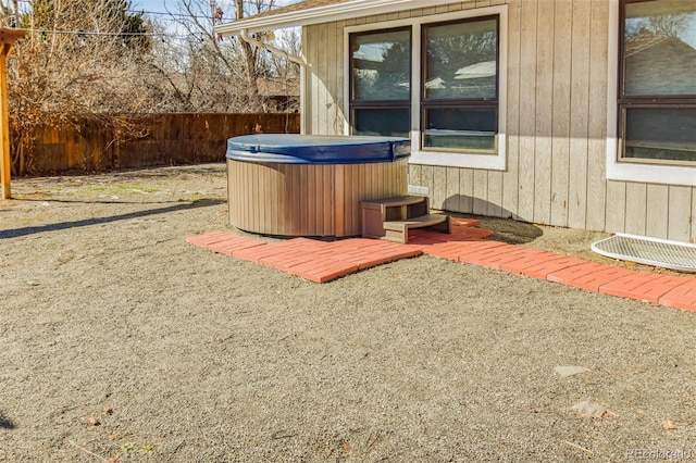 view of patio / terrace with a hot tub