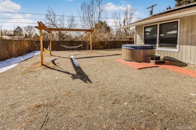 view of yard with a hot tub