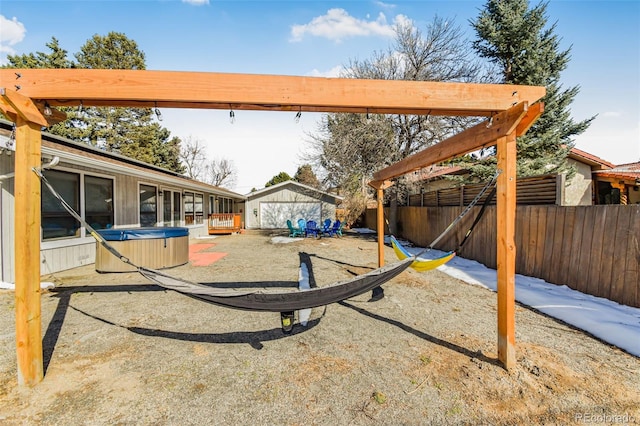 view of yard with a patio, a storage shed, and a hot tub