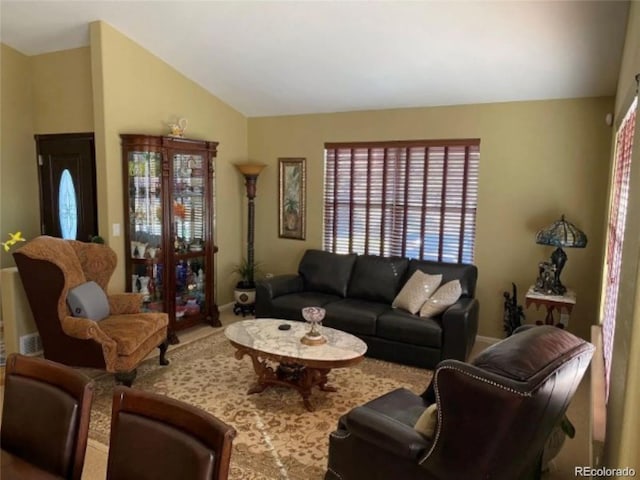 living room with lofted ceiling