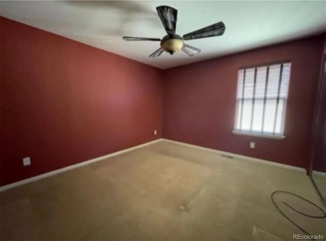 spare room featuring carpet floors