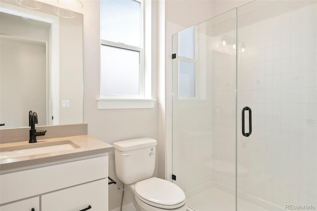 full bath with a shower stall, toilet, and vanity