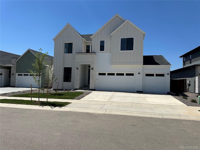 1714 Branching Canopy Dr, Windsor, CO 80550 - modern farmhouse featuring board and batten siding, driveway, an attached garage, and a garage