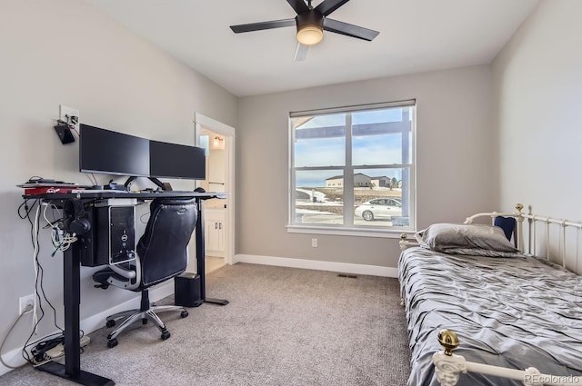 bedroom featuring ceiling fan and carpet