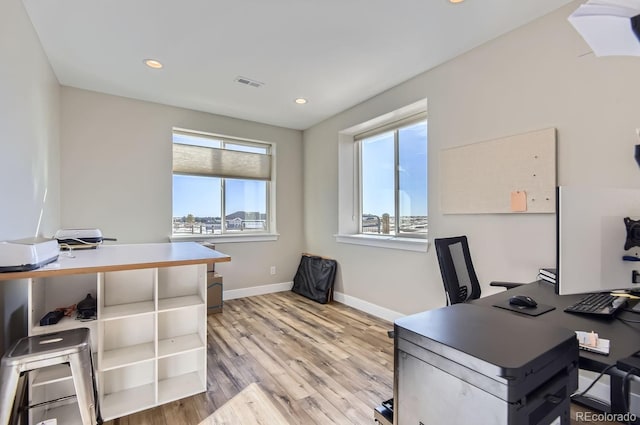 office space with light hardwood / wood-style floors