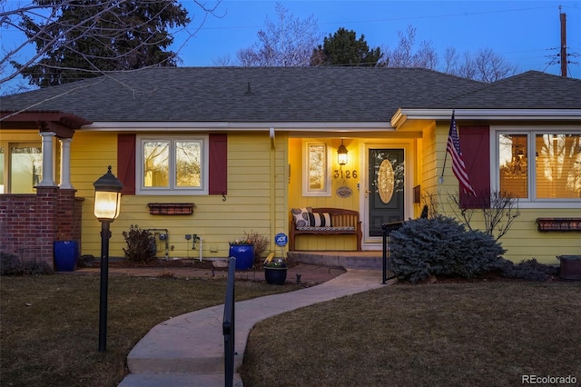 view of front of property featuring a shingled roof