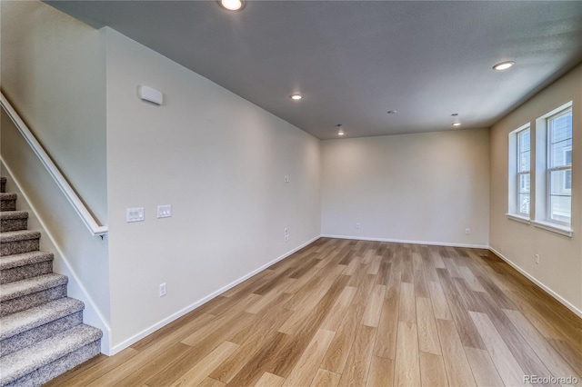 23951 E 40th Ave, Aurora, CO 80019 - unfurnished room featuring light wood-style floors, stairs, recessed lighting, and baseboards