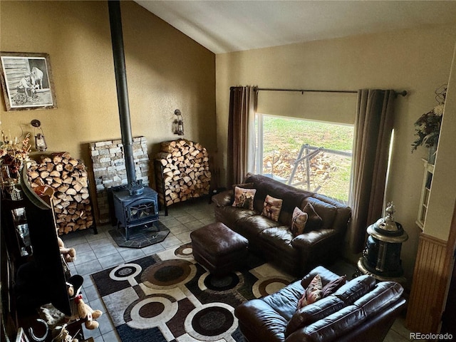 1970 County Road 241, Westcliffe, CO 81252 - living room featuring tile patterned floors, vaulted ceiling, and a wood stove