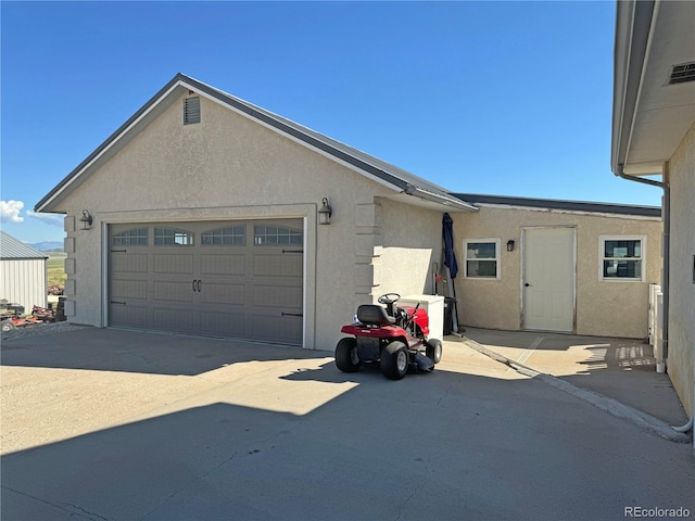 1970 County Road 241, Westcliffe, CO 81252 - view of side of home featuring stucco siding and a garage