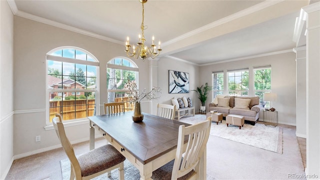 2521 Otter Ct, Lafayette, CO 80026 - dining room featuring light carpet, a chandelier, and ornamental molding