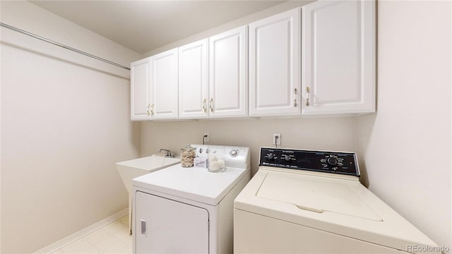 2521 Otter Ct, Lafayette, CO 80026 - washroom with washing machine and dryer and cabinet space