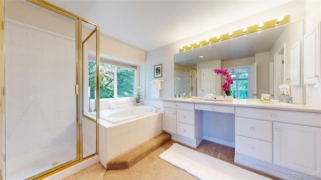 2521 Otter Ct, Lafayette, CO 80026 - full bathroom with double vanity, a stall shower, a garden tub, and tile patterned floors