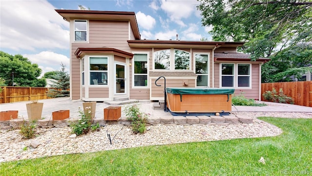 2521 Otter Ct, Lafayette, CO 80026 - back of house featuring a patio area, a hot tub, and a fenced backyard