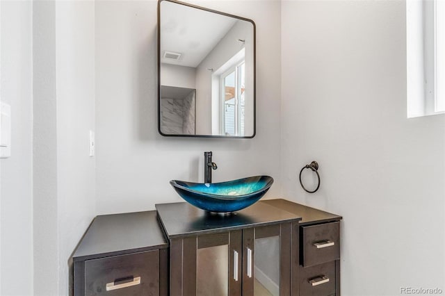 bathroom with vanity and visible vents