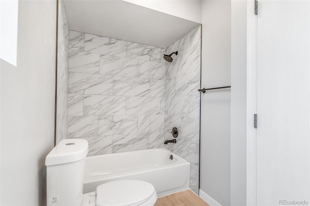 bathroom with toilet and  shower combination