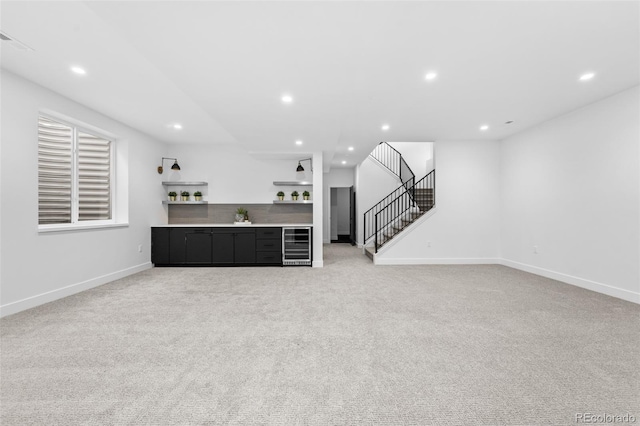 living room with wine cooler and light carpet