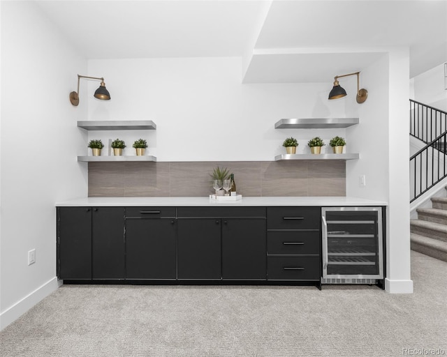 bar featuring light colored carpet and beverage cooler