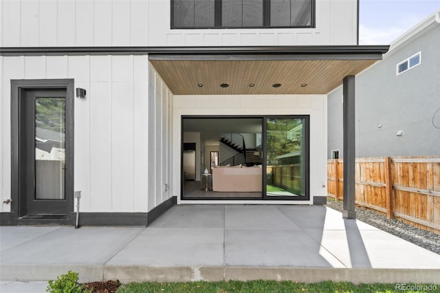 entrance to property featuring a patio area