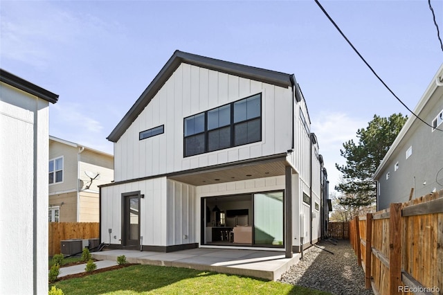 back of property featuring central AC unit and a patio