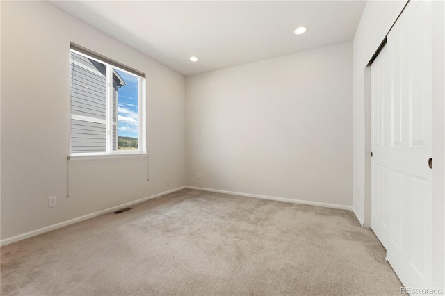 interior space featuring light carpet