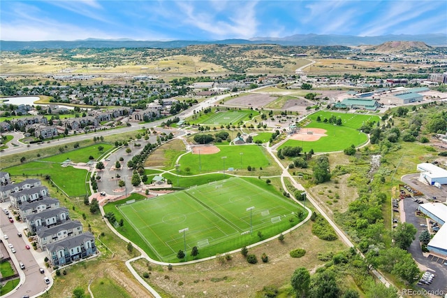 birds eye view of property featuring a mountain view