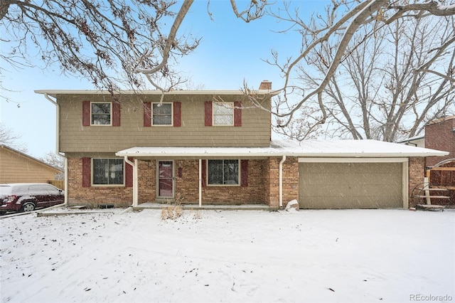 view of front of home with brick siding, a chimney, and an attached garage