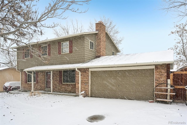 view of front facade featuring a garage, a chimney, and brick siding