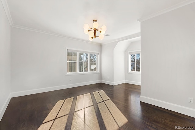 empty room with crown molding, baseboards, dark wood finished floors, and a notable chandelier