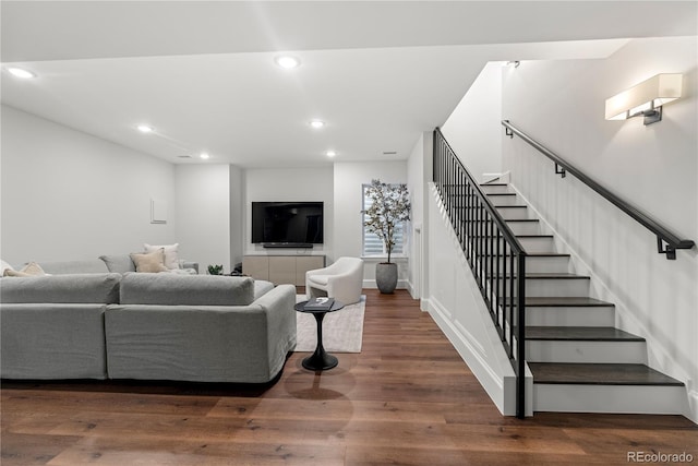 living area with stairway, dark wood-style flooring, and recessed lighting