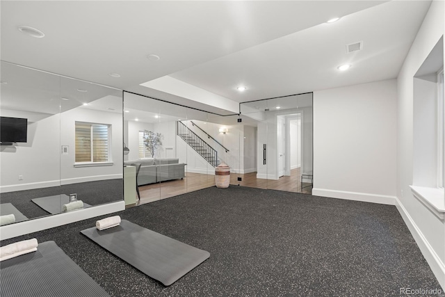 exercise area featuring recessed lighting and baseboards