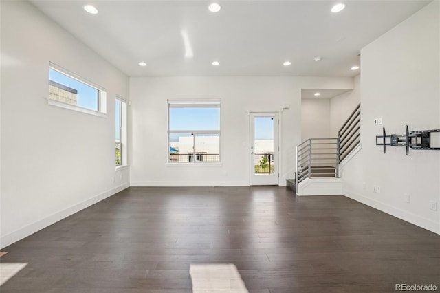 5668 Galena St, Denver, CO 80238 - unfurnished living room with stairs, dark wood finished floors, and recessed lighting